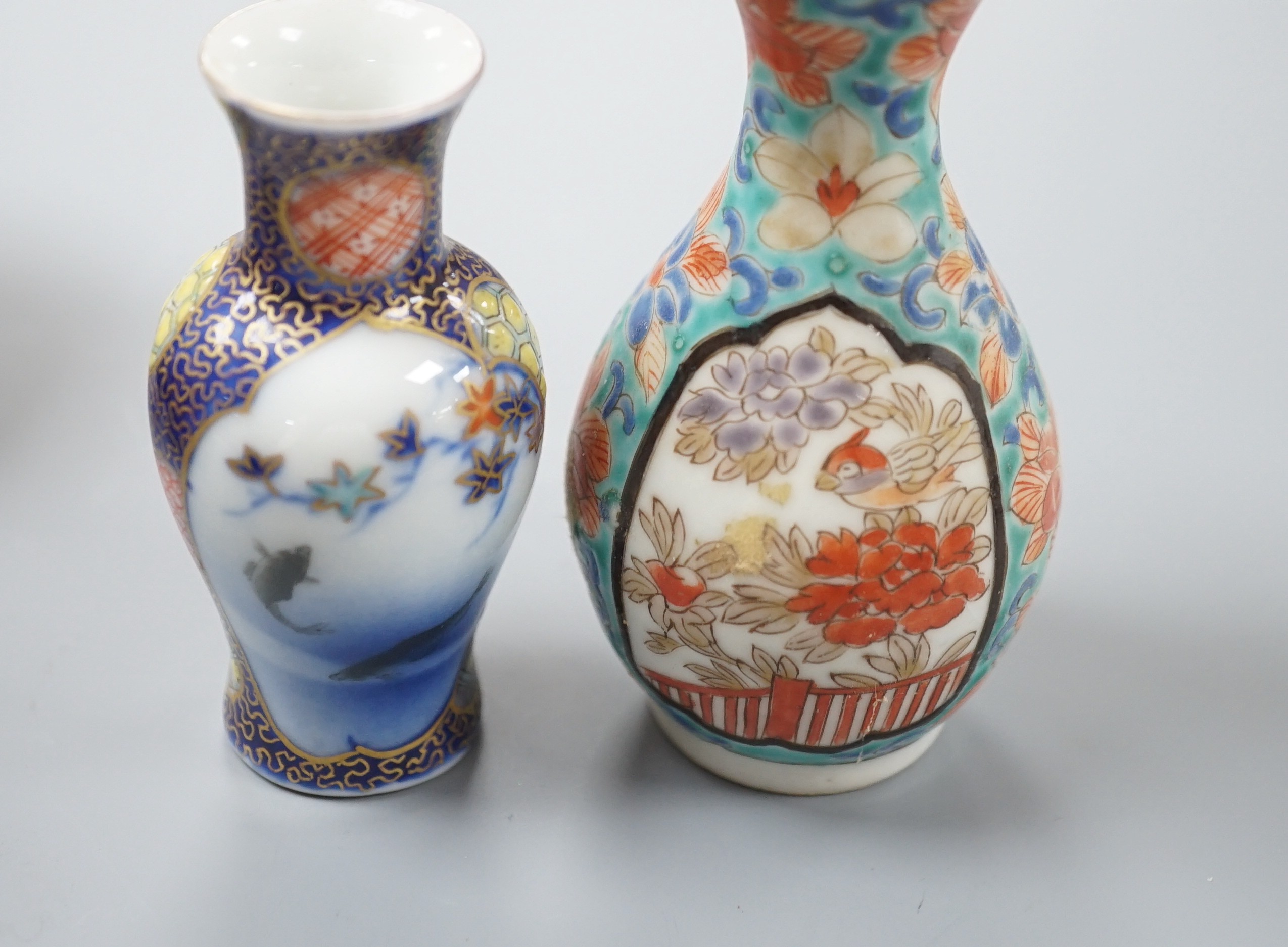 A group of Japanese small or miniature Kutani and Imari vessels and three Satsuma pottery mounted brooches, largest 11.7cm